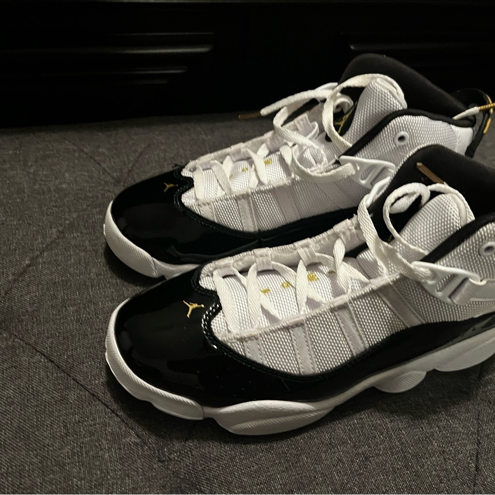Jordan White and Black Retro Basketball Sneakers with Gold Accents
